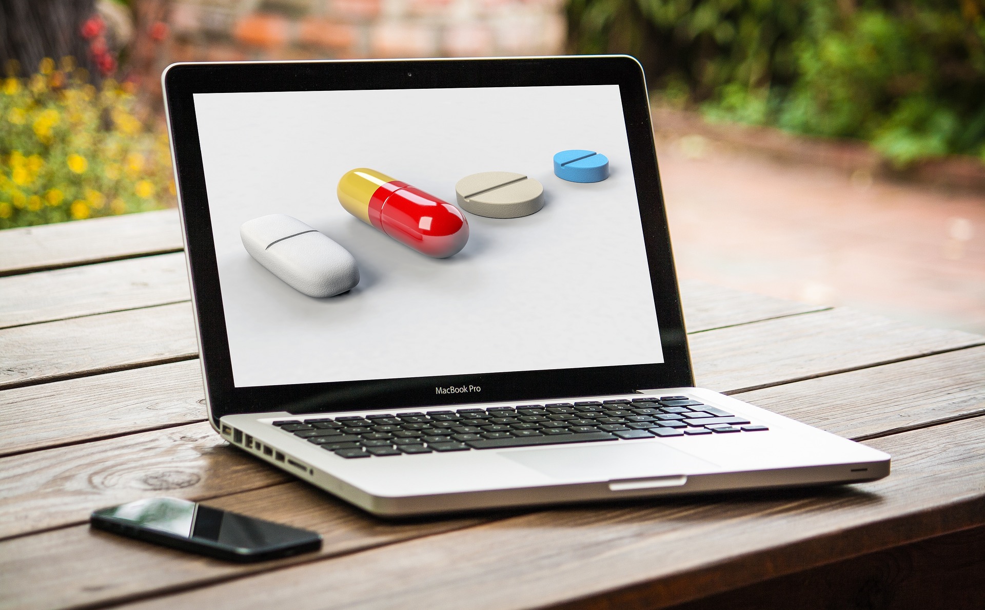 Laptop, der Pillen zeigt